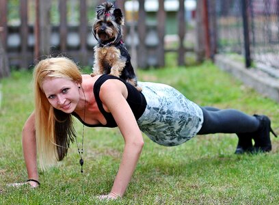 Woman push up dog photo