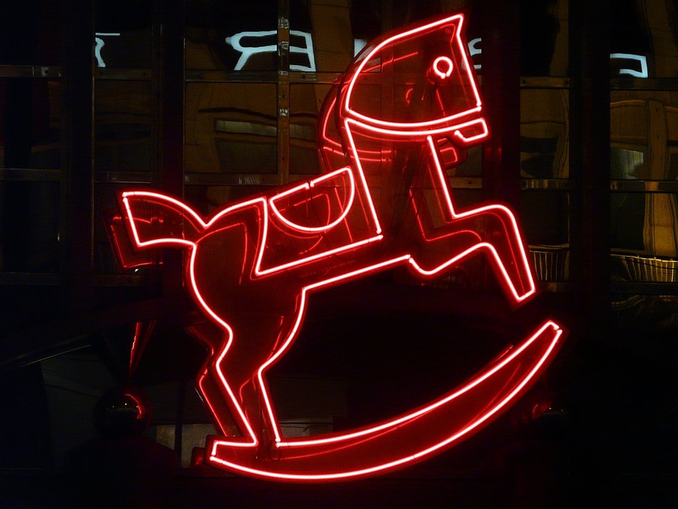 Neon light neon red rocking horse photo