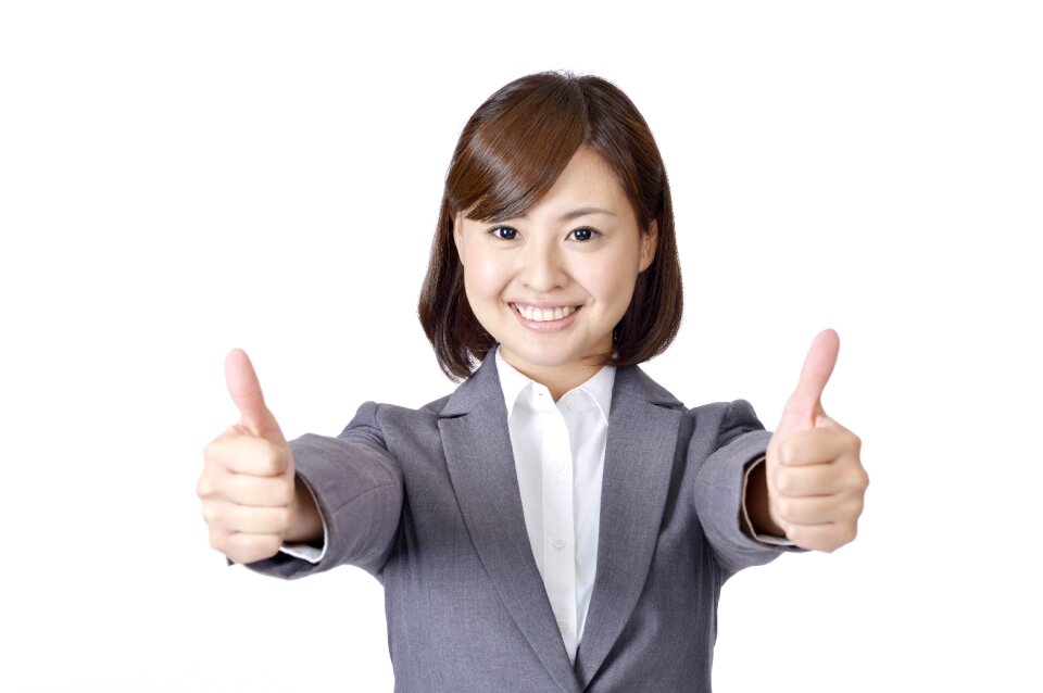 Business woman thumbs up