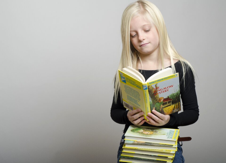 Child girl reading book