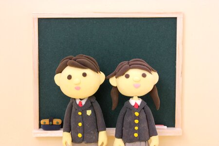 Dolls couple student blackboard photo