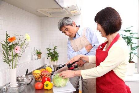 Old couple cooking