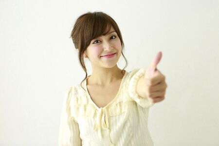 Woman girl portrait thumbs up photo