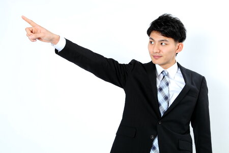 Business man pointing finger photo