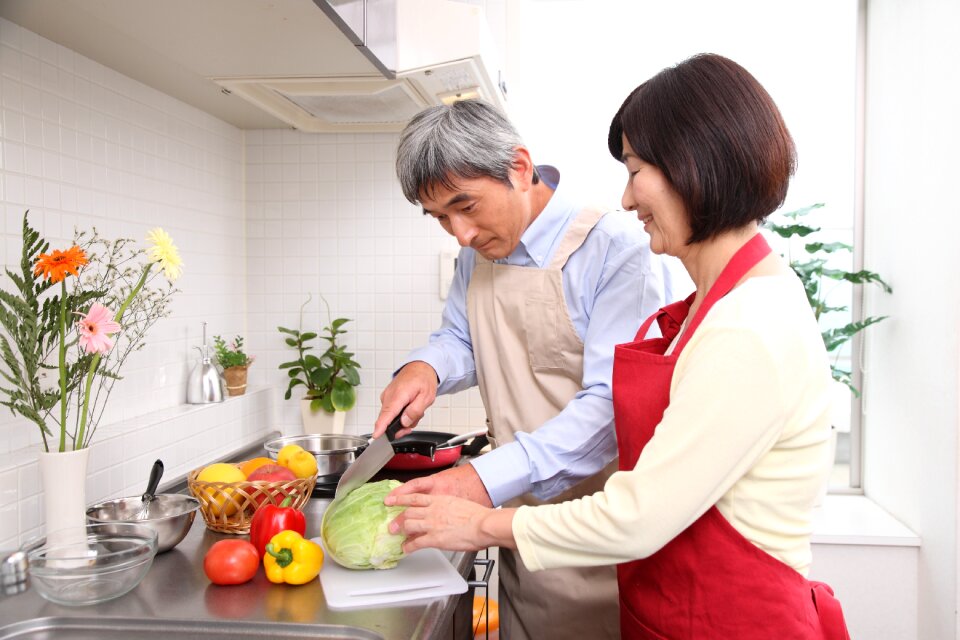 Old couple cooking