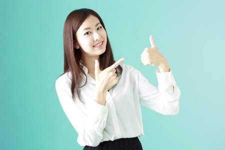 Business woman thumbs up photo