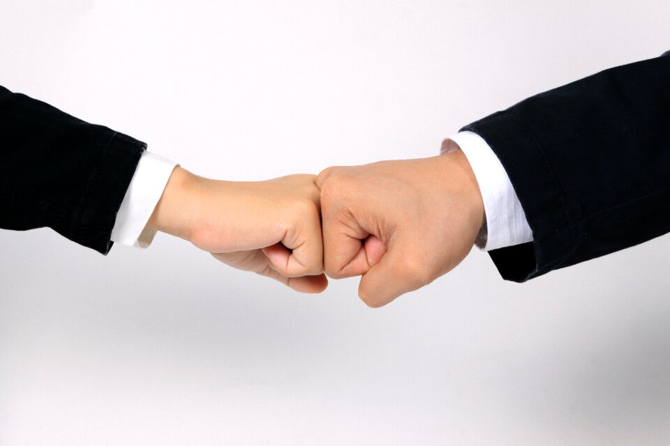 Business hands fist bump
