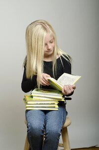 Child girl reading book photo