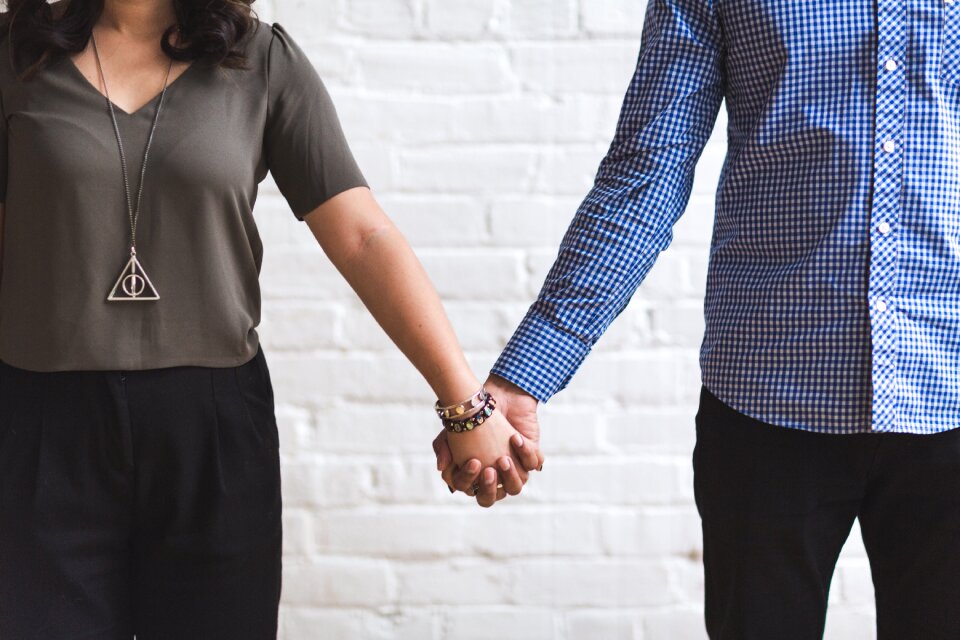 Couple holding hands