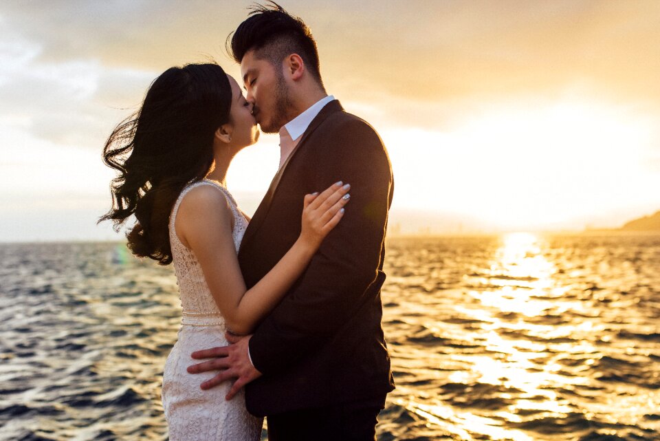 Couple kiss bride groom