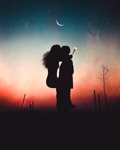 Couple kiss sunset