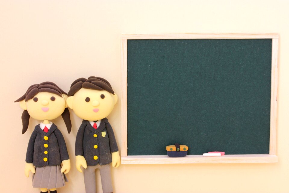 Dolls couple student blackboard