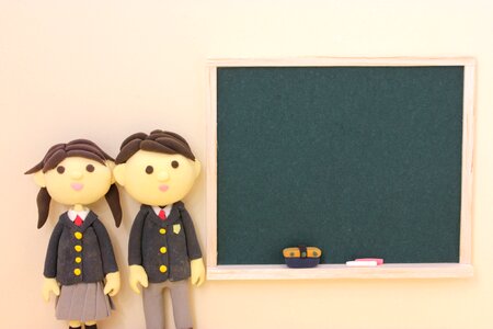 Dolls couple student blackboard photo