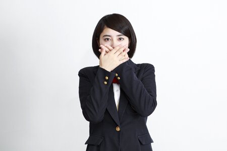 Female student cover mouth