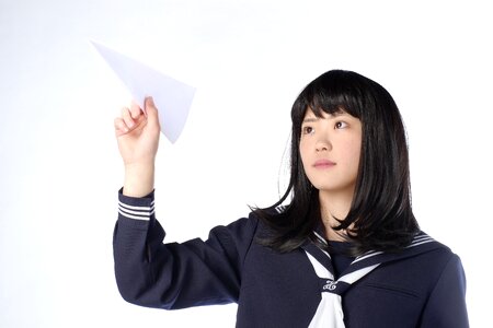 Female student paper airplane photo