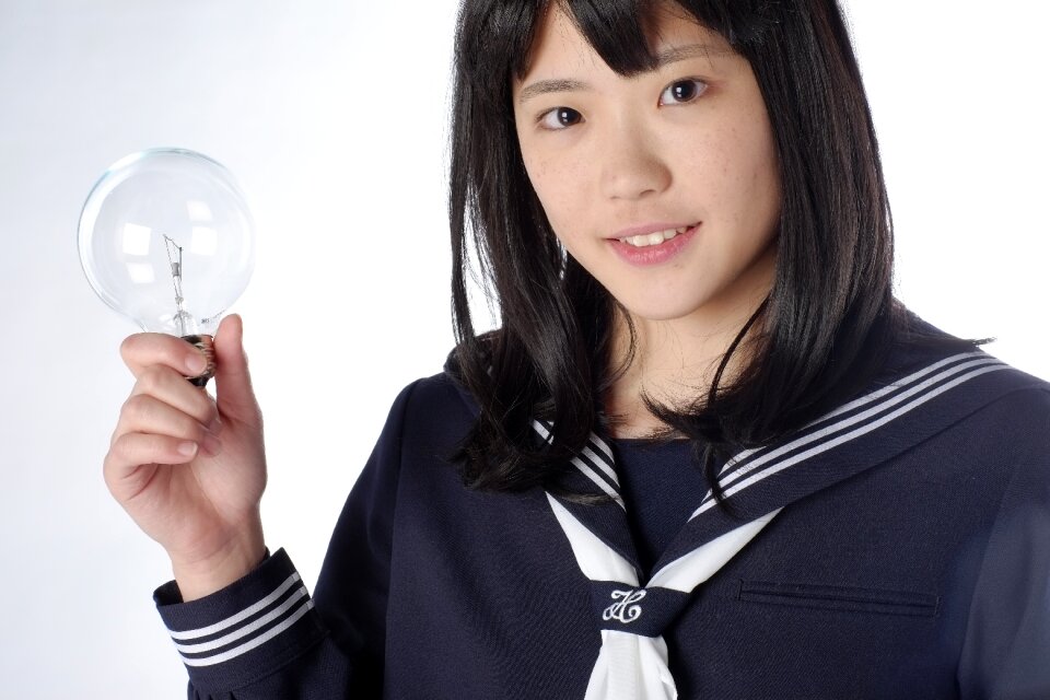 Female student light bulb