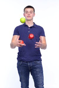 Man portrait juggling apples