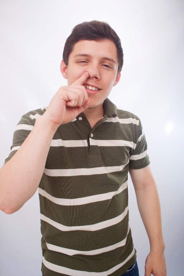 Man portrait nose finger