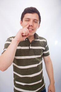 Man portrait nose finger