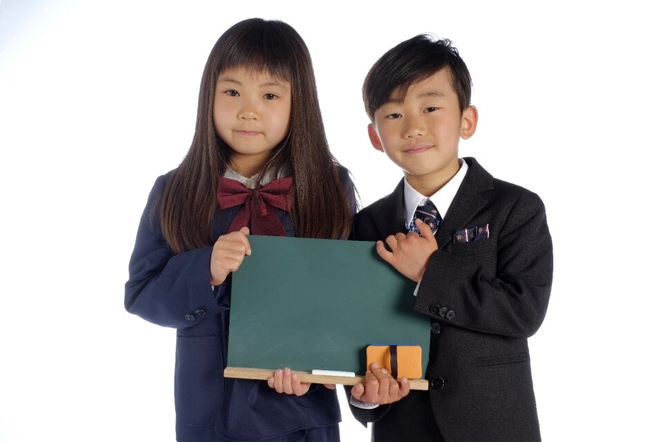 Schoolgirl schoolboy children blackboard