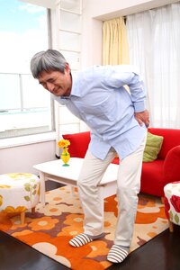 Senior man low back pain photo