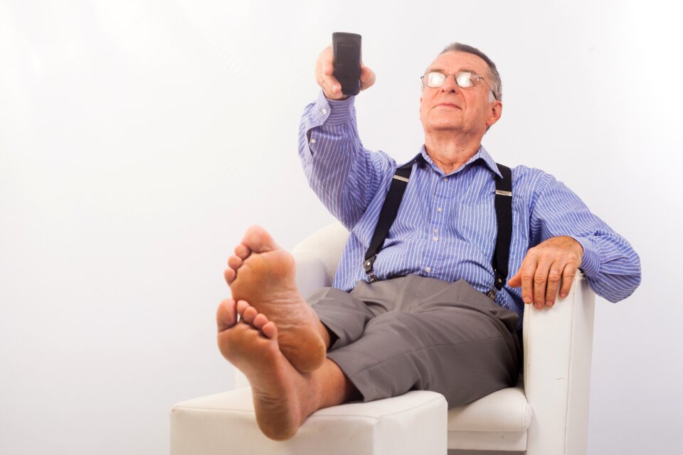Senior man watching tv
