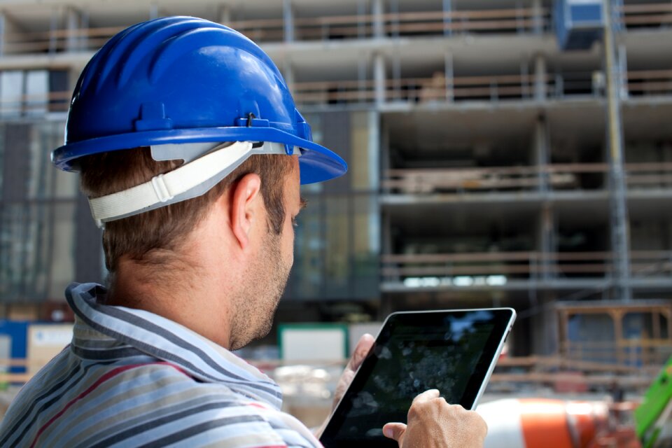 Tablet pc construction worker photo