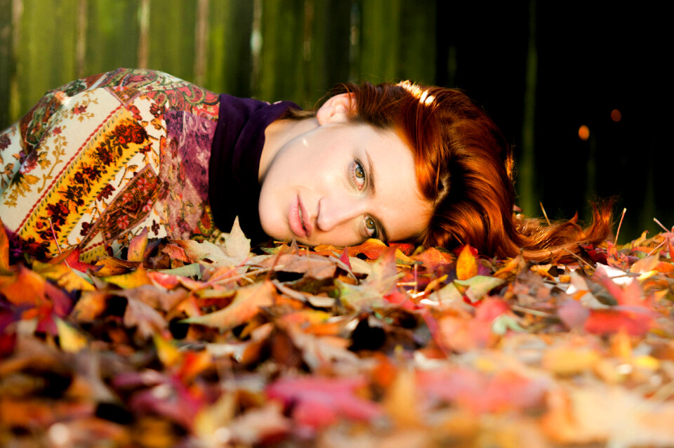 Woman girl fallen leaves