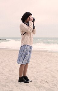 Woman camera beach