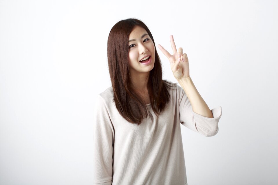 Woman girl portrait v sign