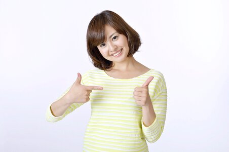 Woman girl thumbs up photo