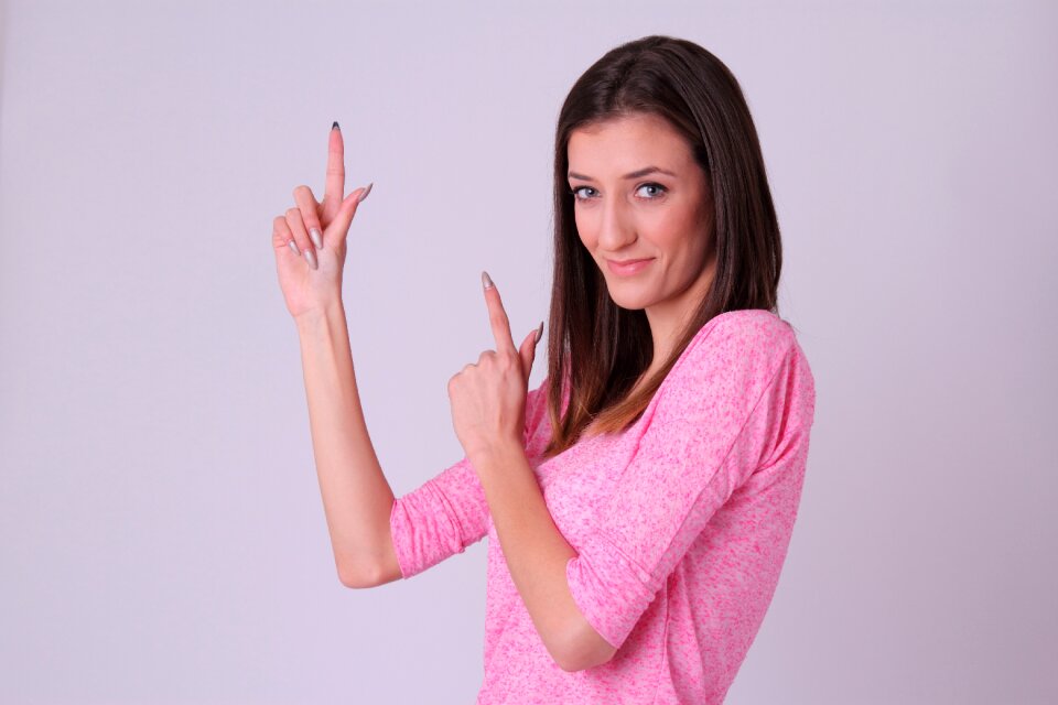 Woman portrait pointing finger
