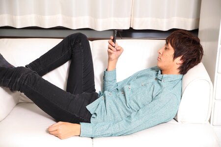 Man sofa smartphone