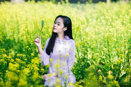 Woman girl canola flower photo