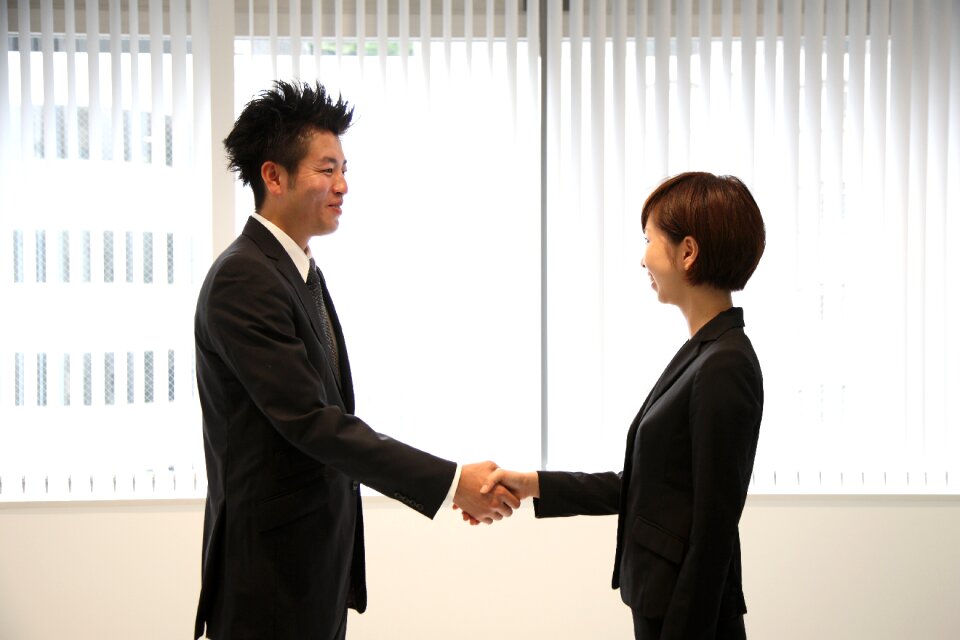 Businessman businesswoman handshake