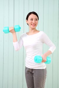 Woman girl training dumbbell