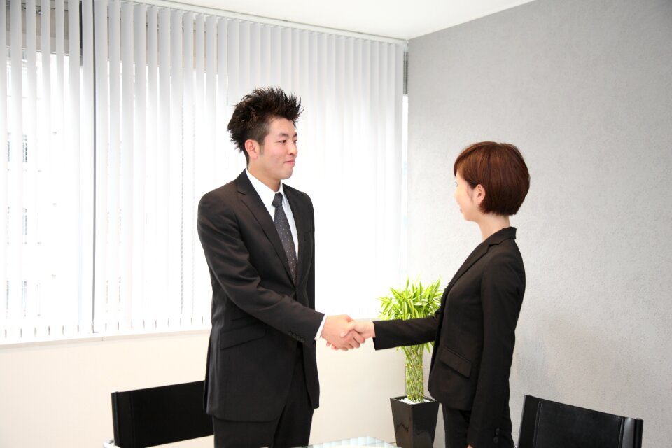Businessman businesswoman handshake