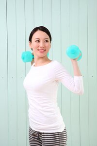 Woman girl training dumbbell