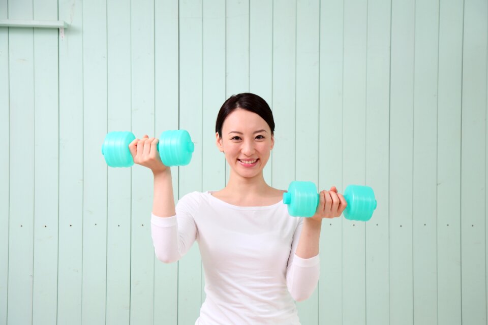 Woman girl training dumbbell
