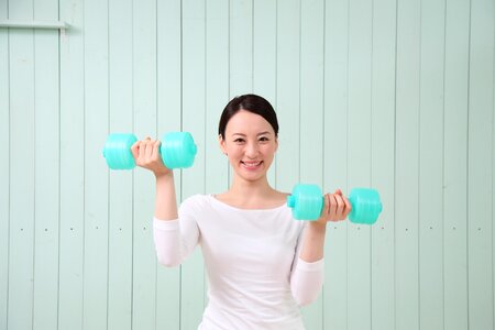 Woman girl training dumbbell