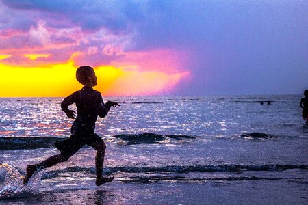 Beach child boy running photo