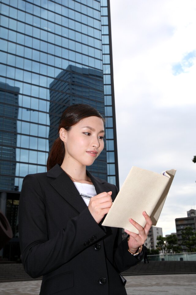 Business woman phone notebook