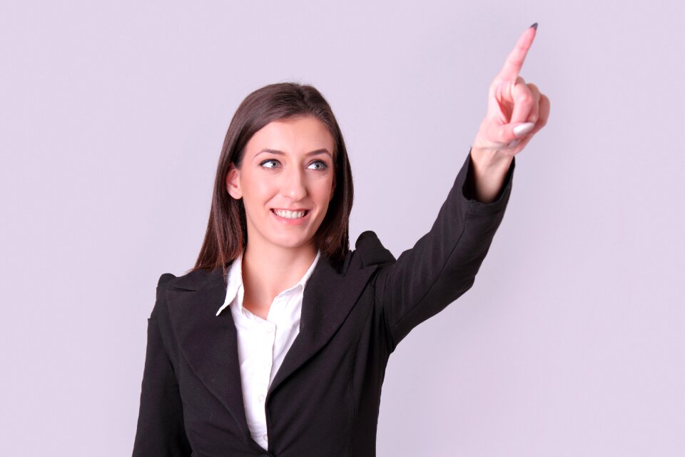 Businesswoman pointing finger
