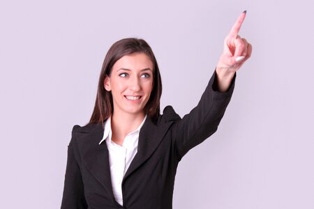 Businesswoman pointing finger photo