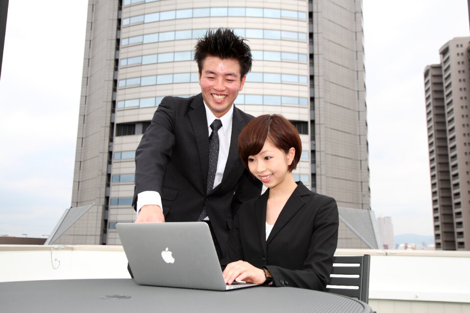 Businessman businesswoman laptop computer