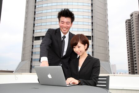 Businessman businesswoman laptop computer photo