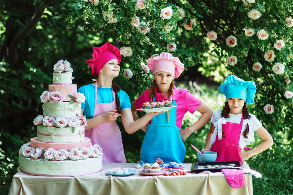 Children girls cook cake