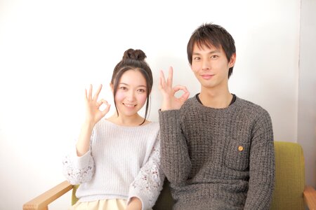 Couple ok sign photo