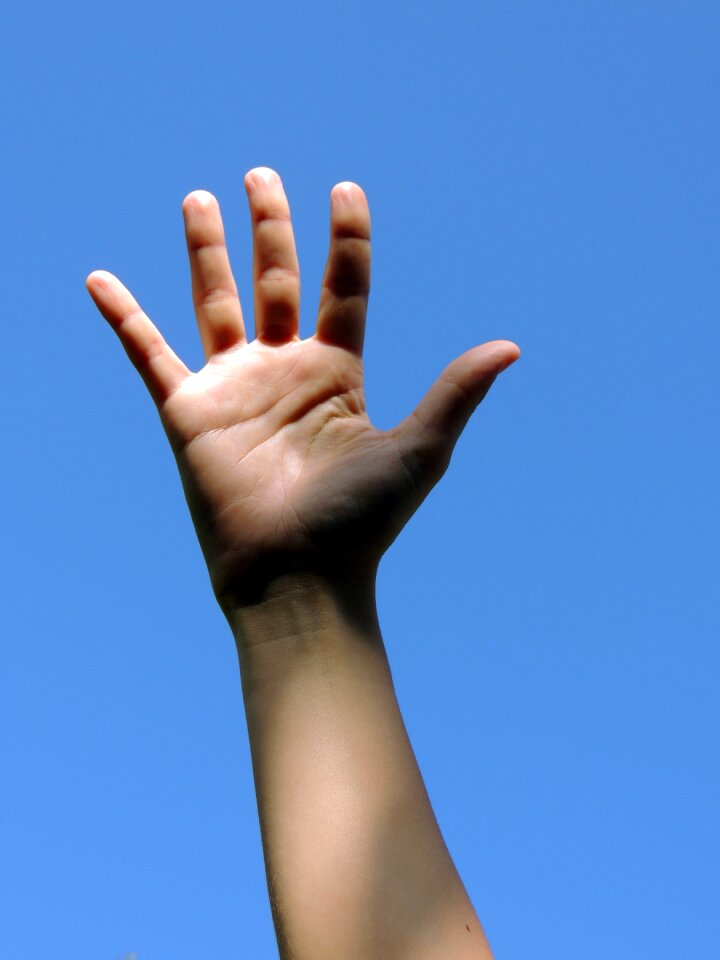 Hand blue sky
