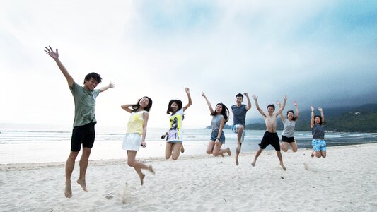 Group jump beach photo